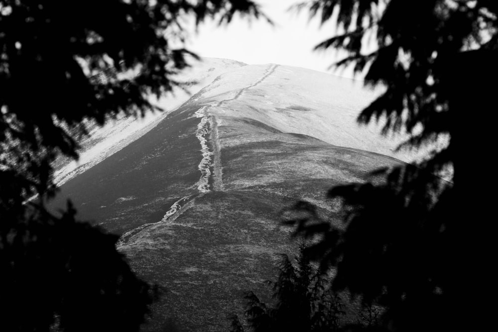 a black and white photo of a mountain