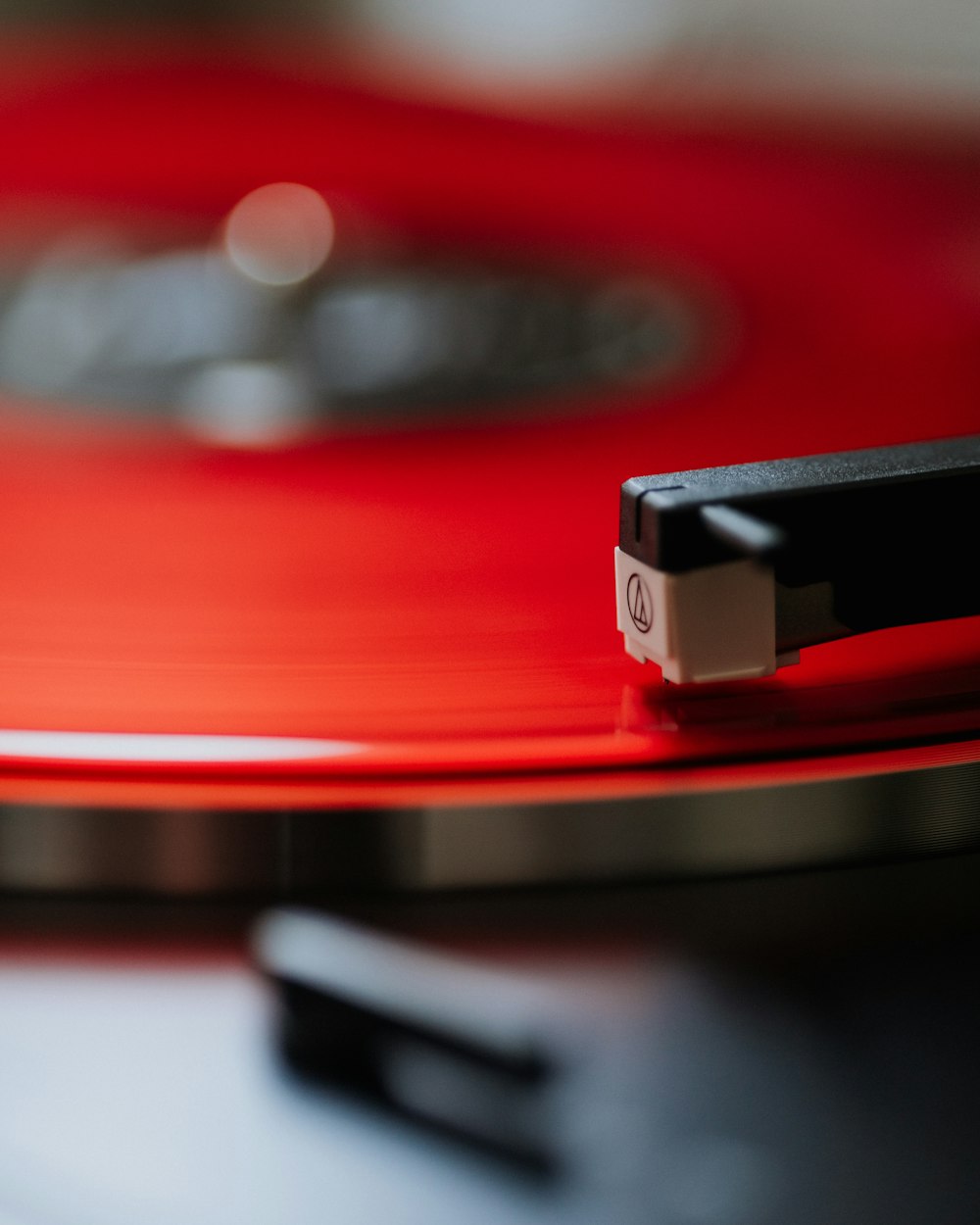 a close up of a red record player