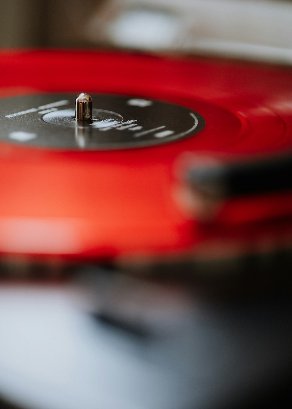 a close up of a red record player