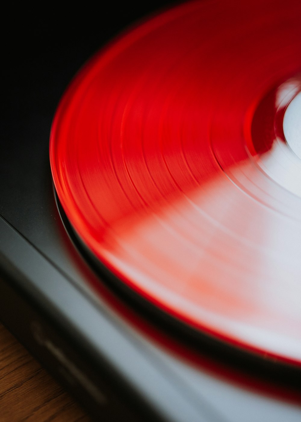 a turntable with a red record on top of it