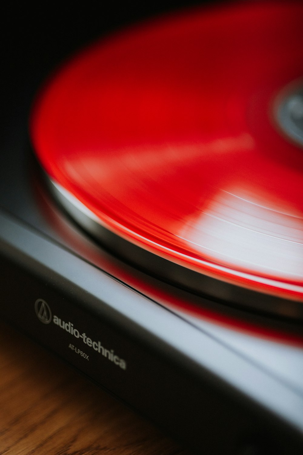 a close up of a turntable on a wooden table