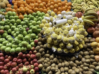 A colorful assortment of fresh fruits displayed in a market setting.