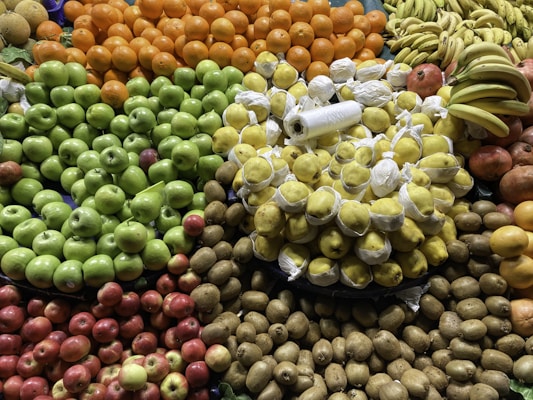 Fresh fruits and vegetables neatly arranged in a colorful market display.