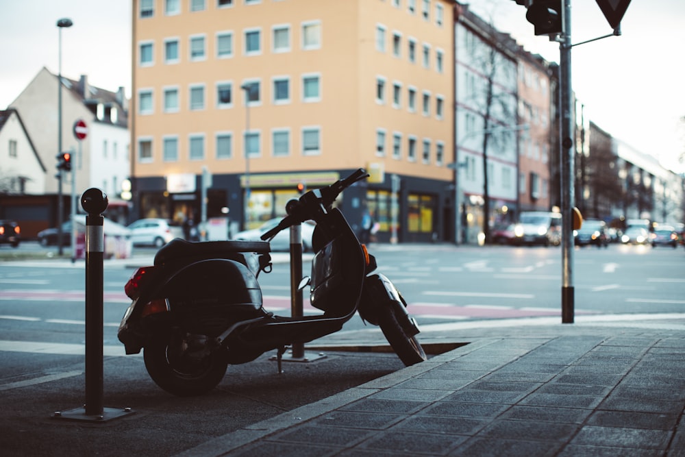 a scooter parked on the side of the road