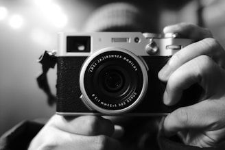 a person holding a camera in their hands
