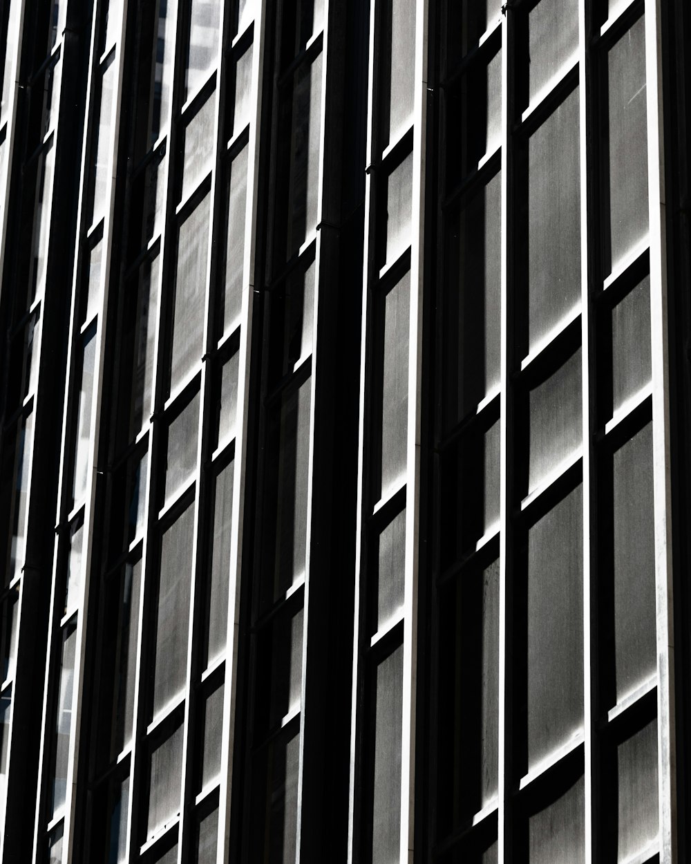 a black and white photo of a tall building