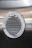 a close up of a metal object with a round hole