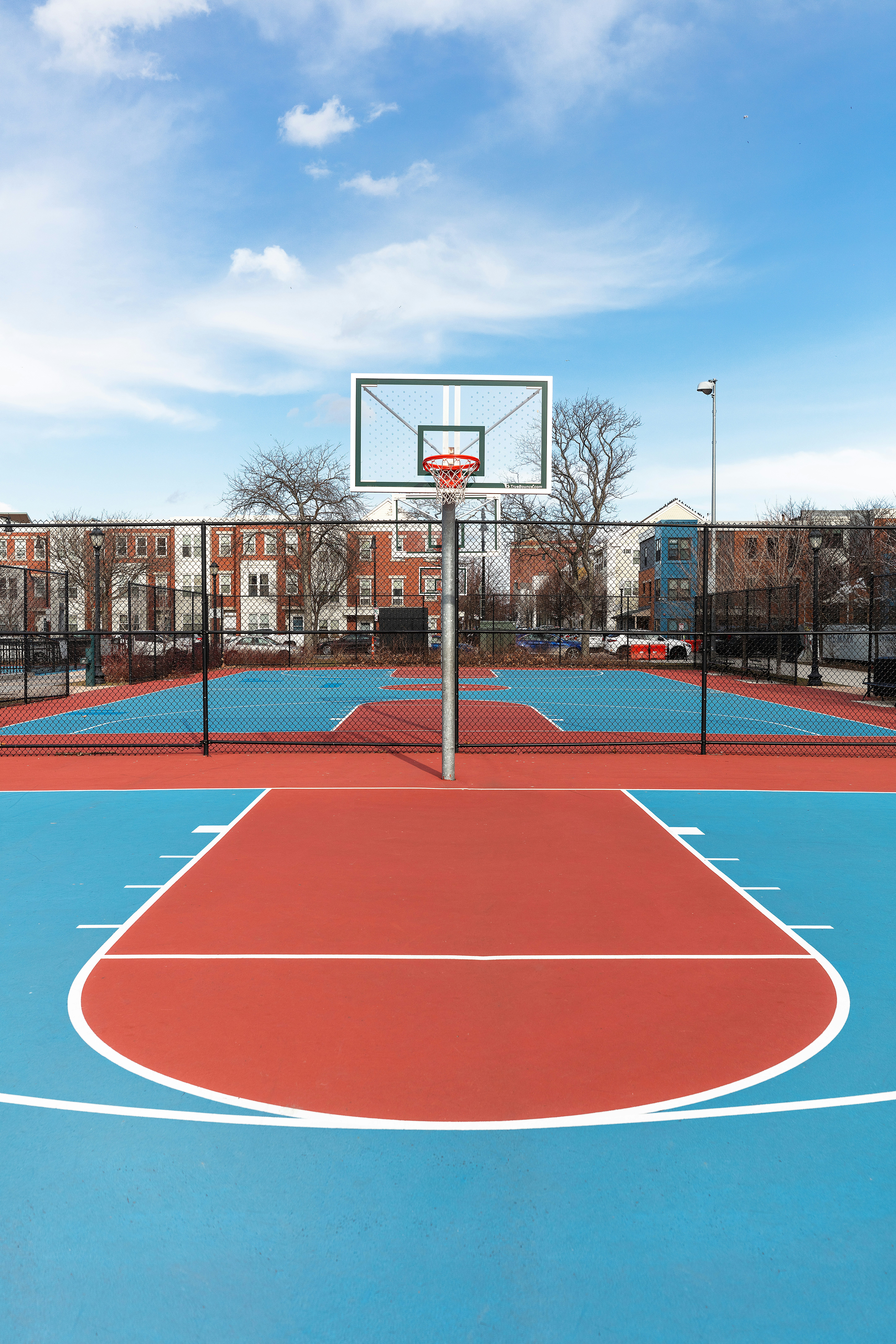a basketball court with a basketball hoop in the middle of it