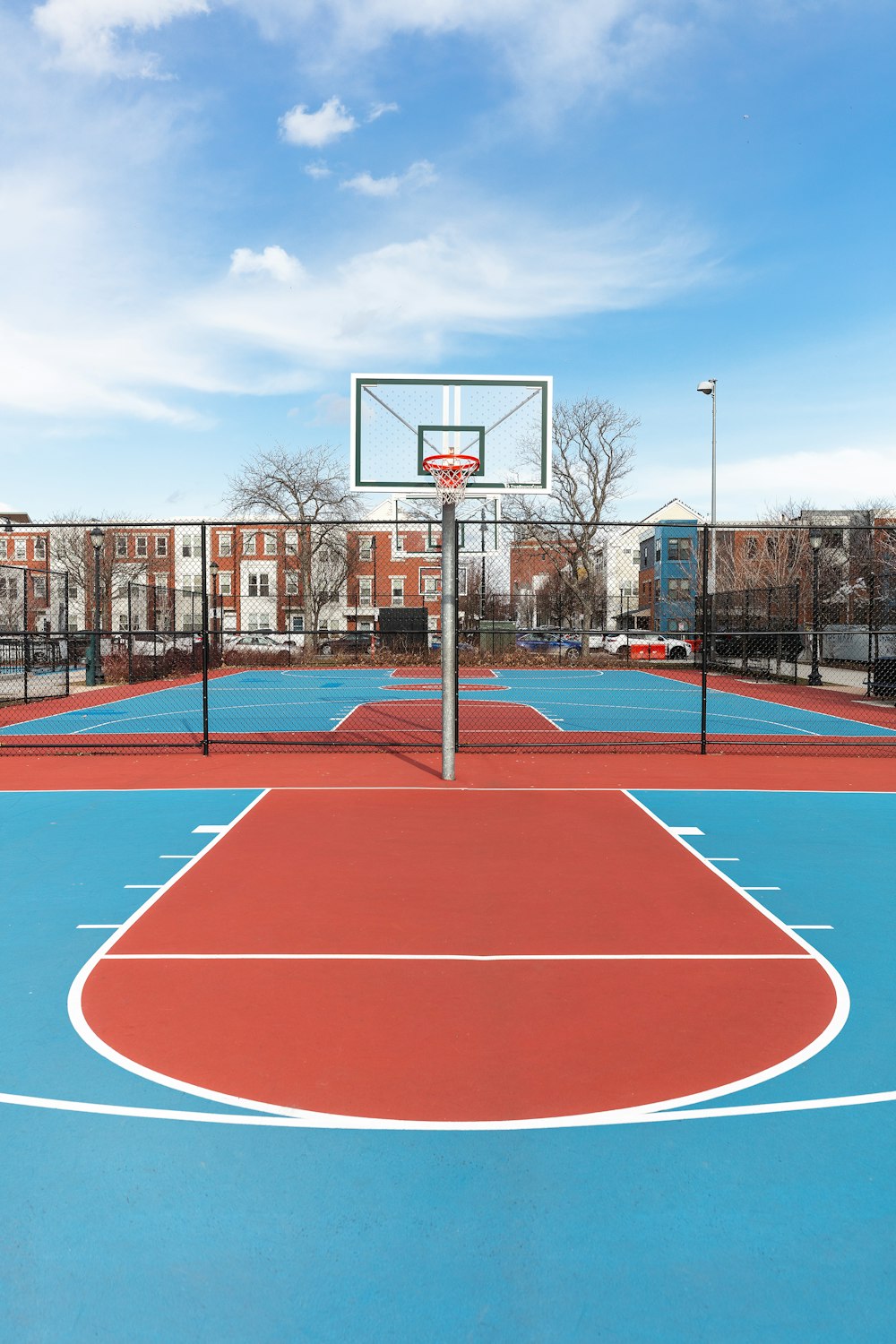 a basketball court with a basketball hoop in the middle of it