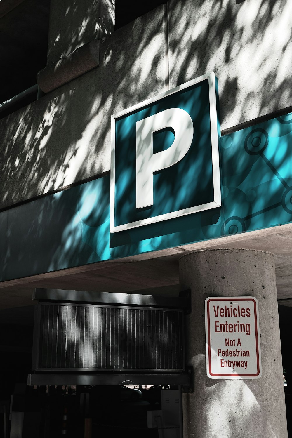 a parking sign on the side of a building