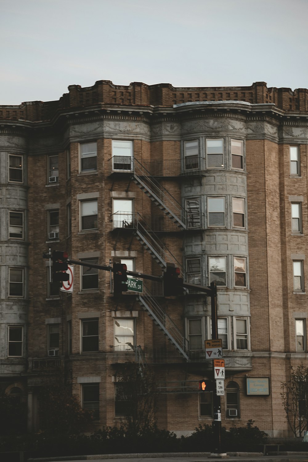 a tall building with a fire escape on the top of it