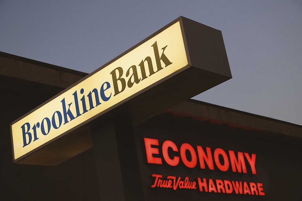 a branch of a bank with a sign above it
