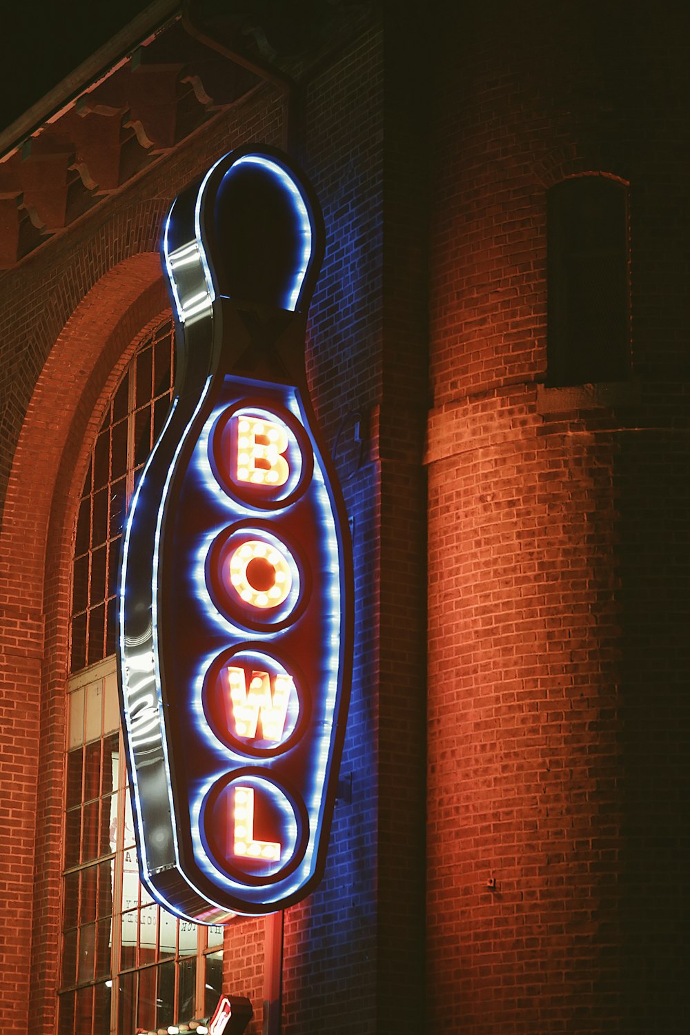 a neon sign on the side of a building