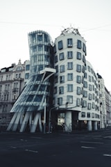 a large building with a curved facade on a city street