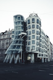 a large building with a curved facade on a city street