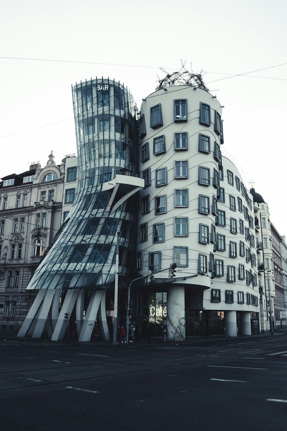 a large building with a curved facade on a city street