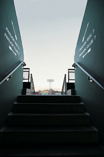 a set of stairs leading up to a stadium