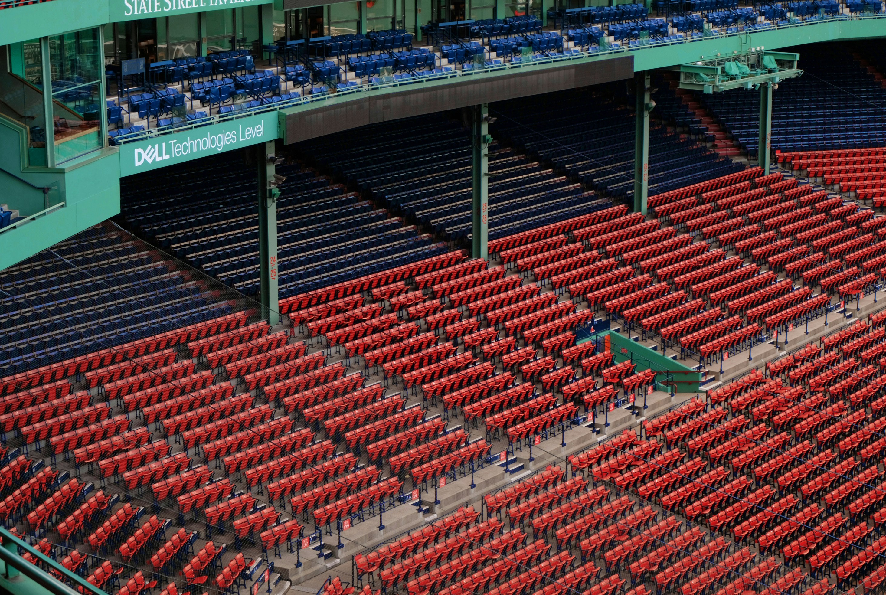 a stadium filled with lots of red seats, 