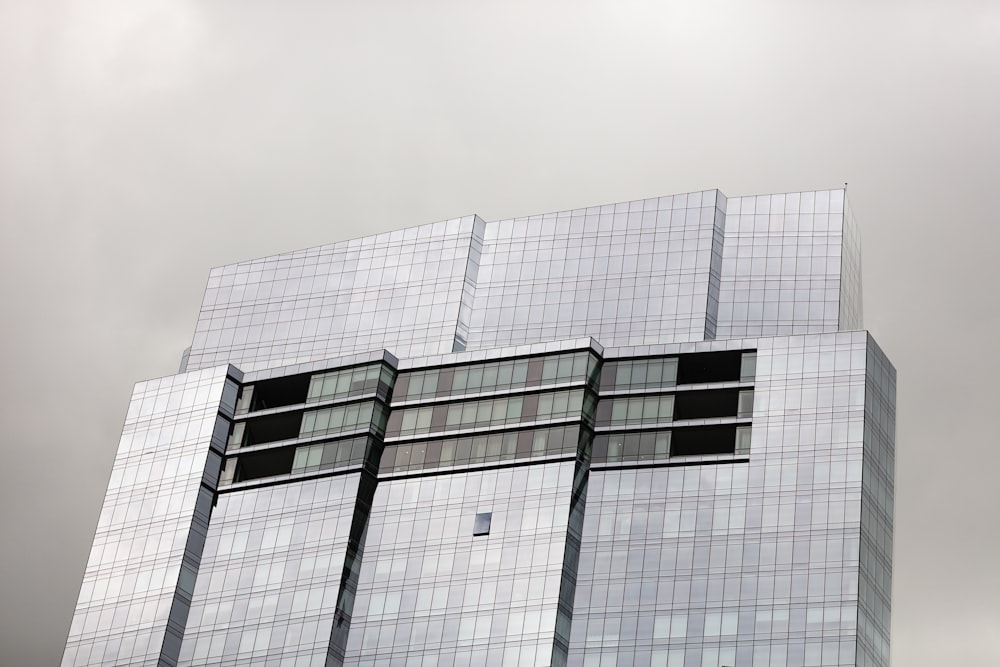 a very tall building with a clock on it's side