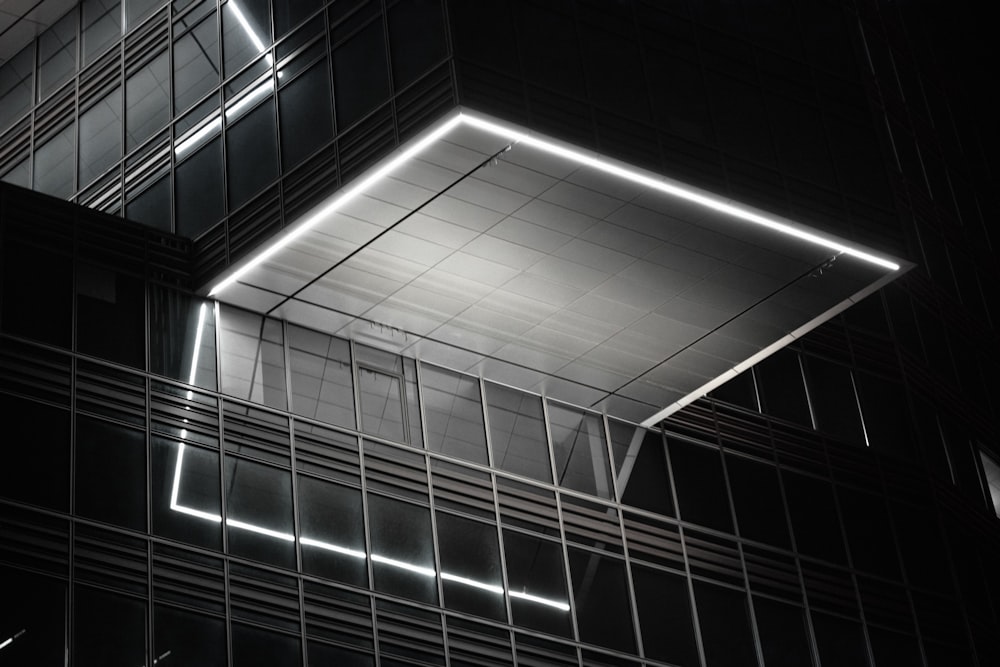 a black and white photo of a building at night