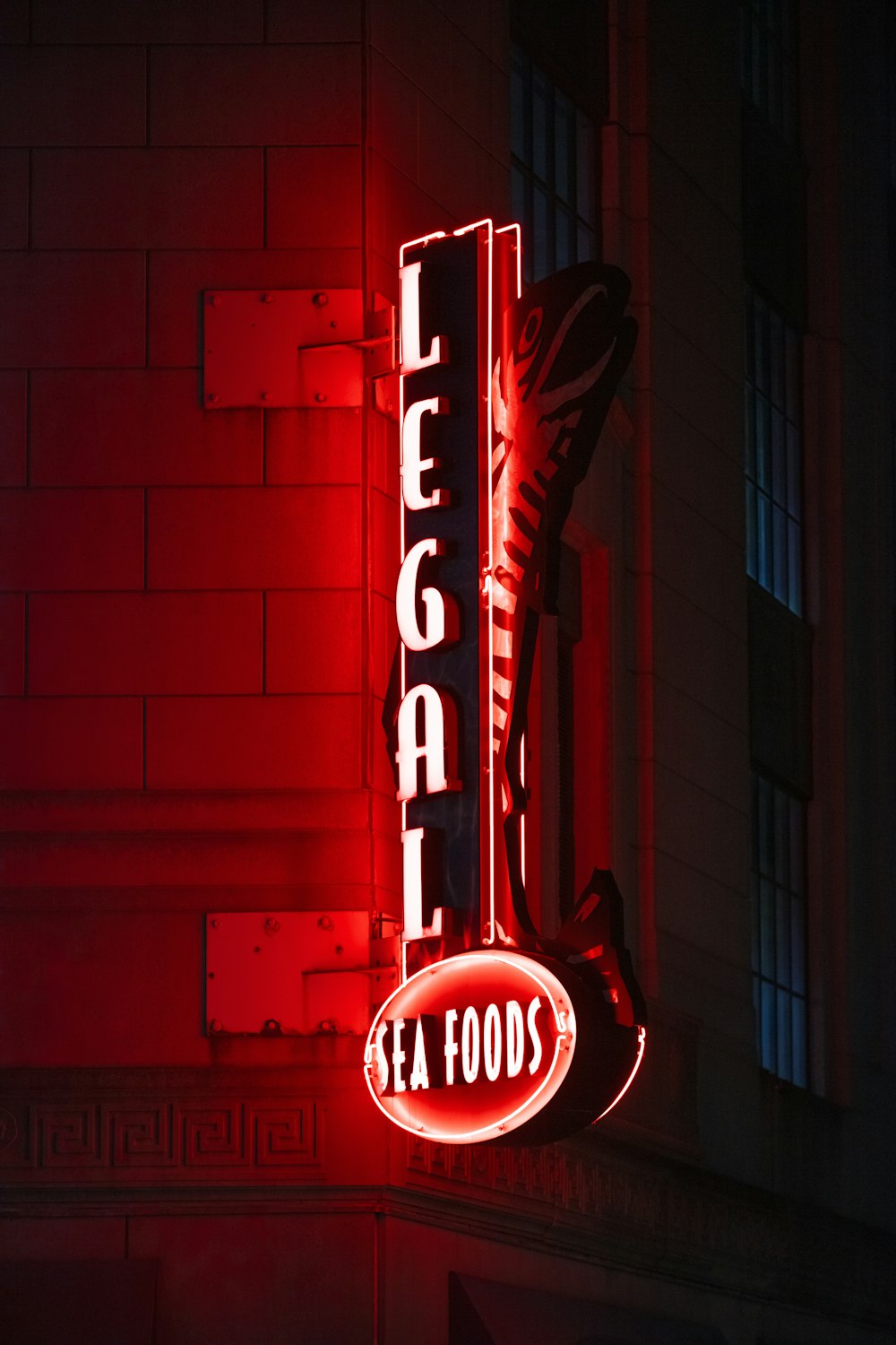 a neon sign on the side of a building