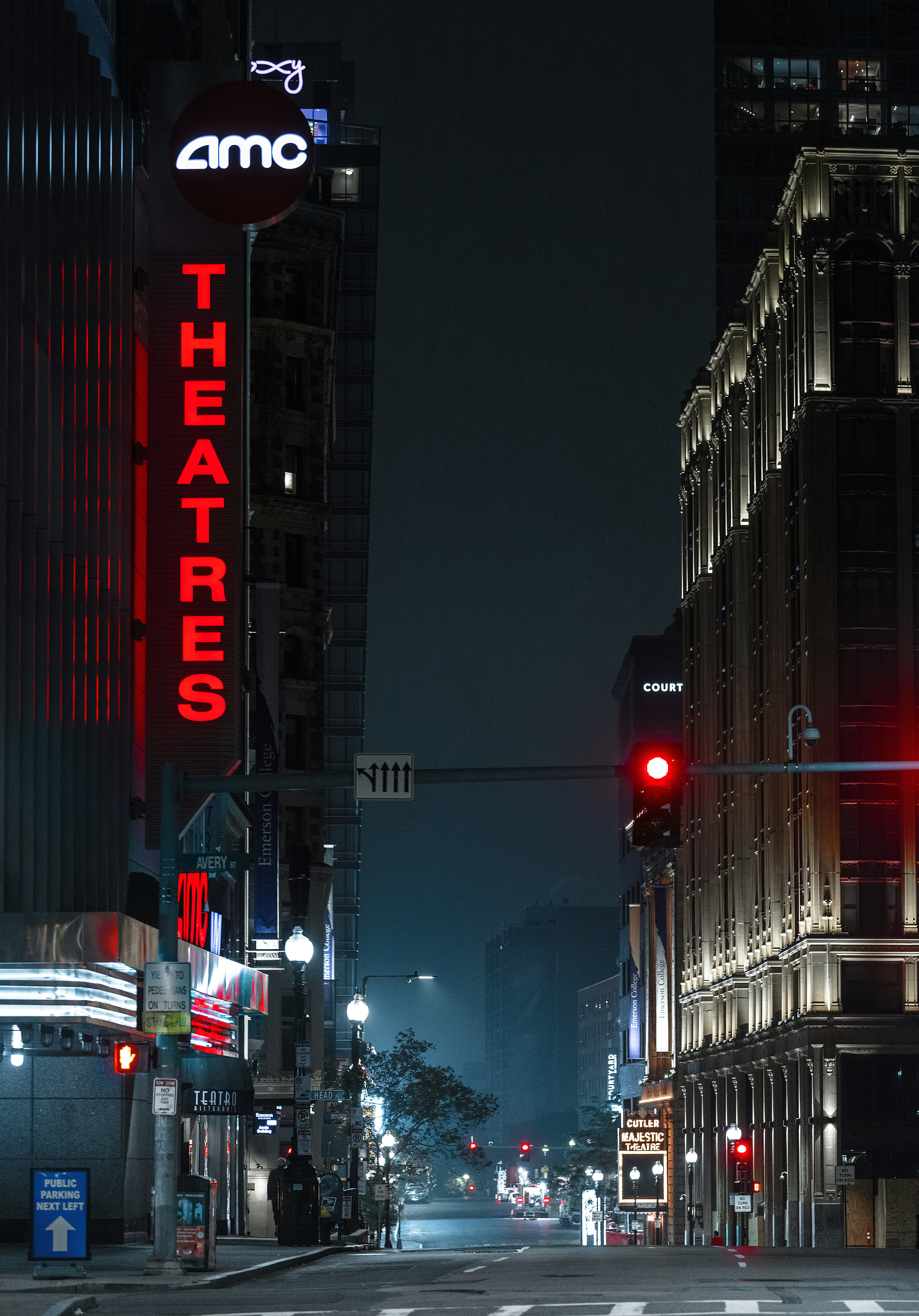 a red traffic light sitting on the side of a road
