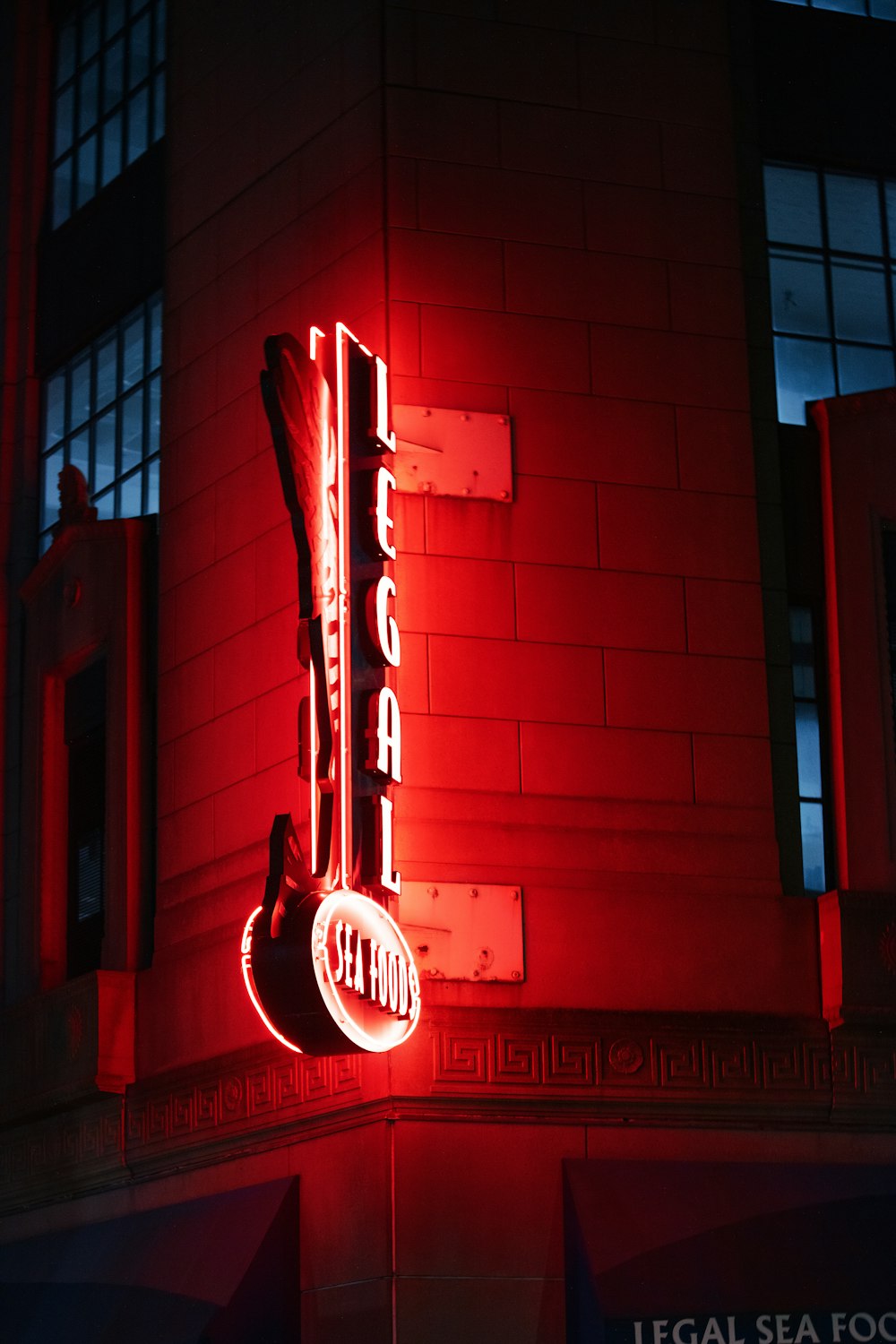 a neon sign on the side of a building