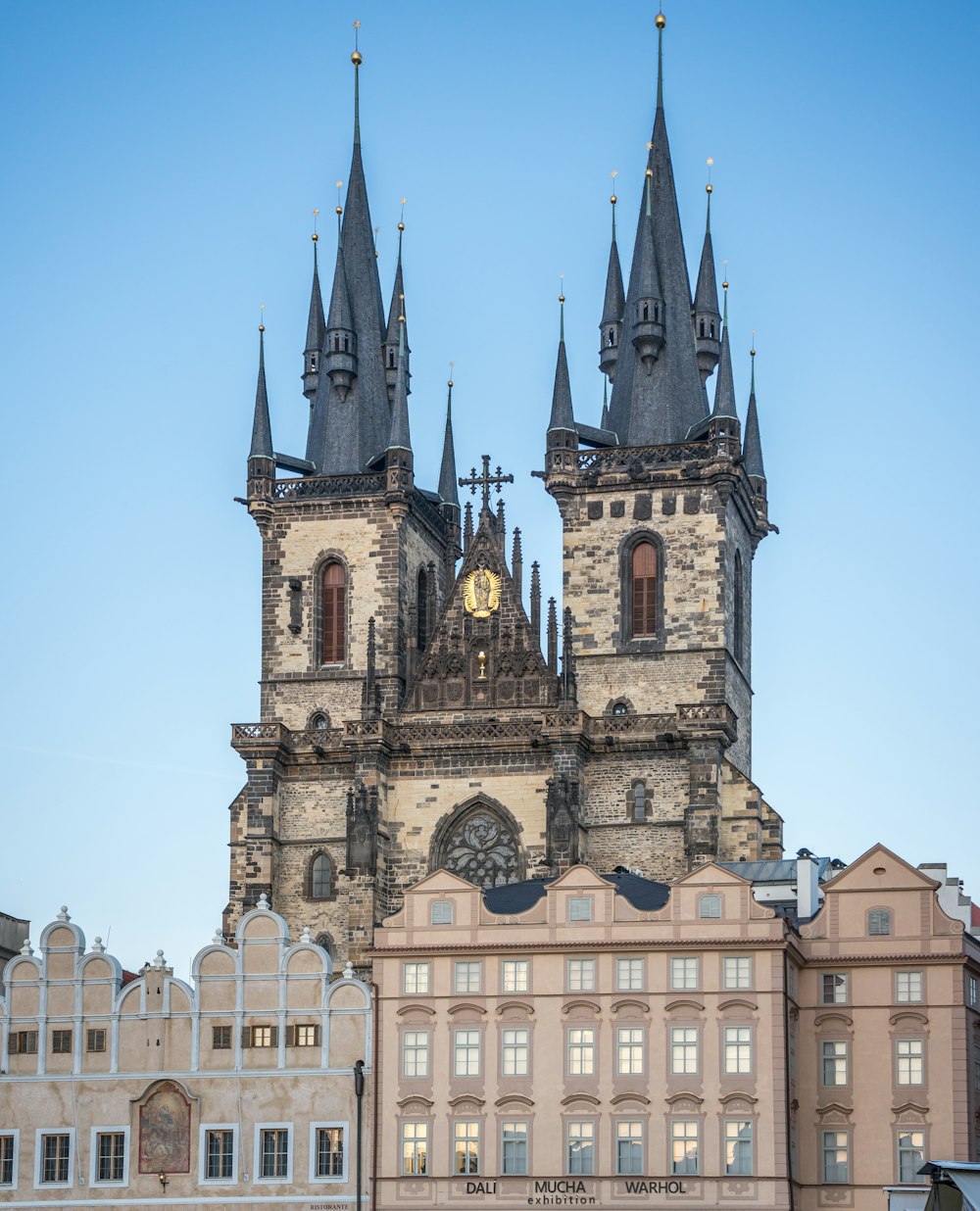 a very tall building with a clock on it's side