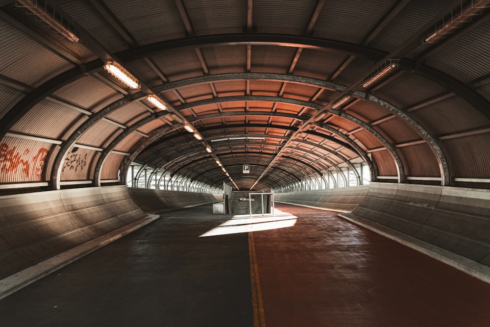 a tunnel with a red floor and a red floor