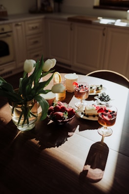 A rustic wooden table adorned with assorted lemon-flavored confections.