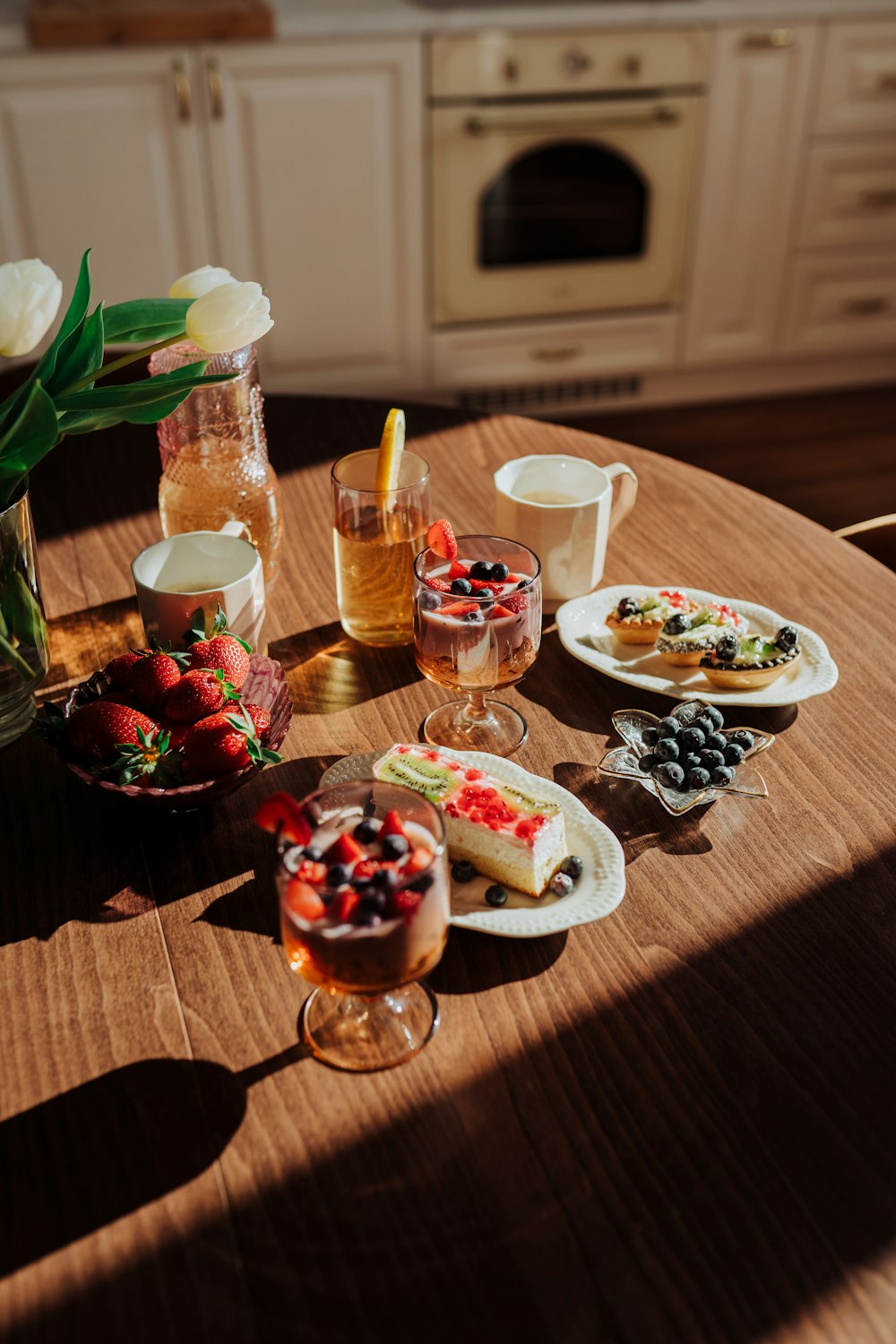 a wooden table topped with plates of food