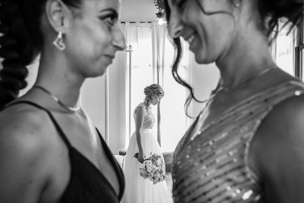 a bride and her bridesmaids getting ready for their wedding