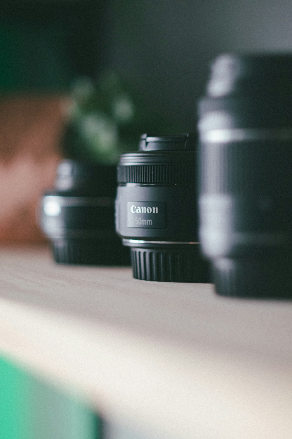 a close up of three camera lenses on a table