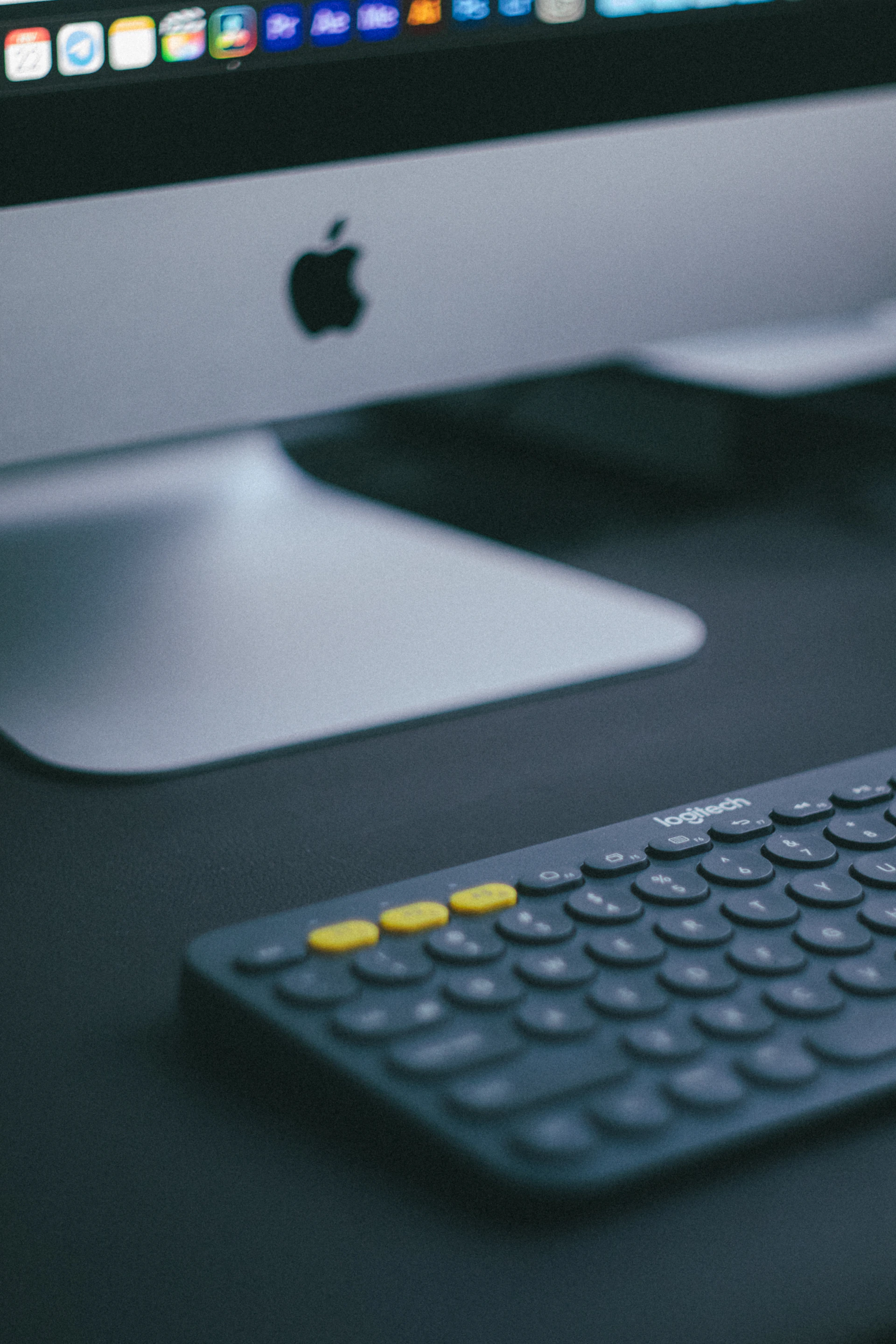 a computer keyboard sitting next to a monitor