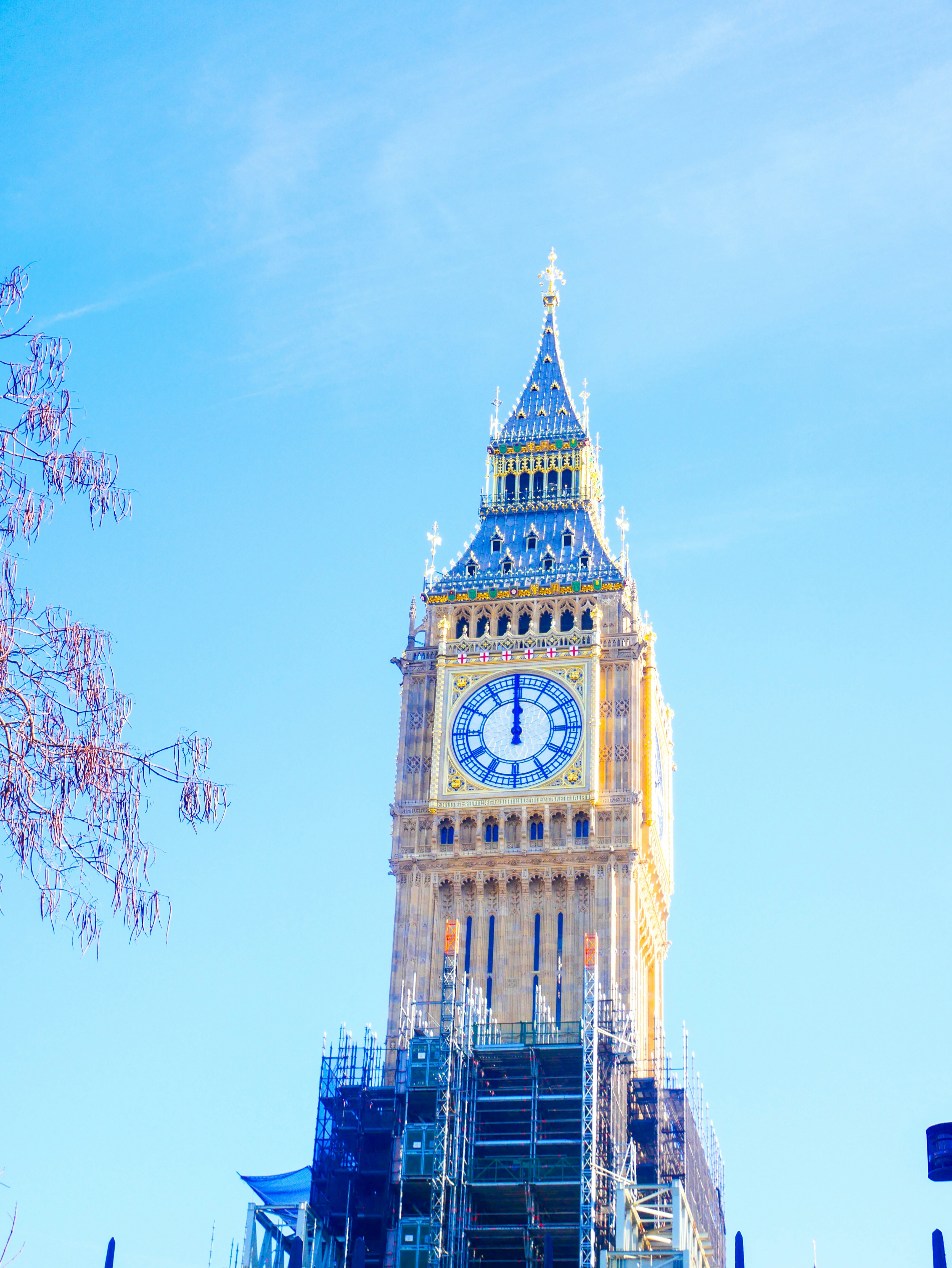 a large clock tower with scaffolding around it