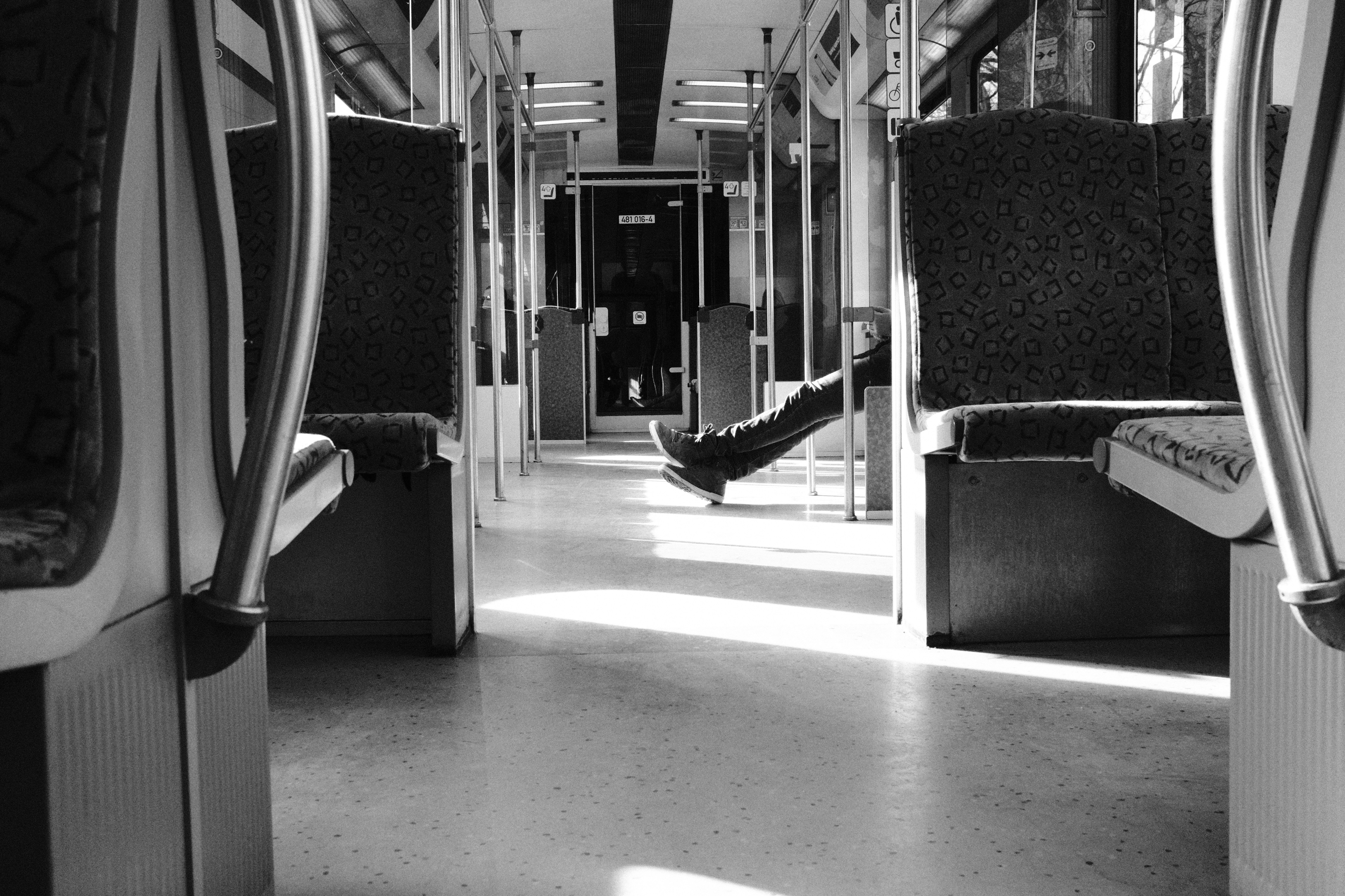 a black and white photo of a long hallway