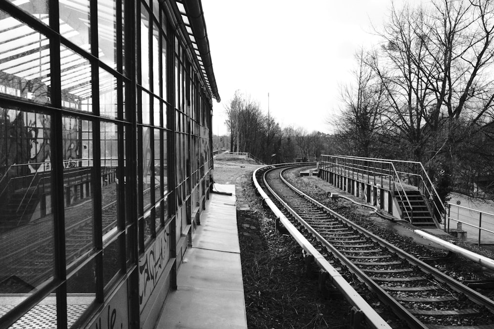 a black and white photo of a train track