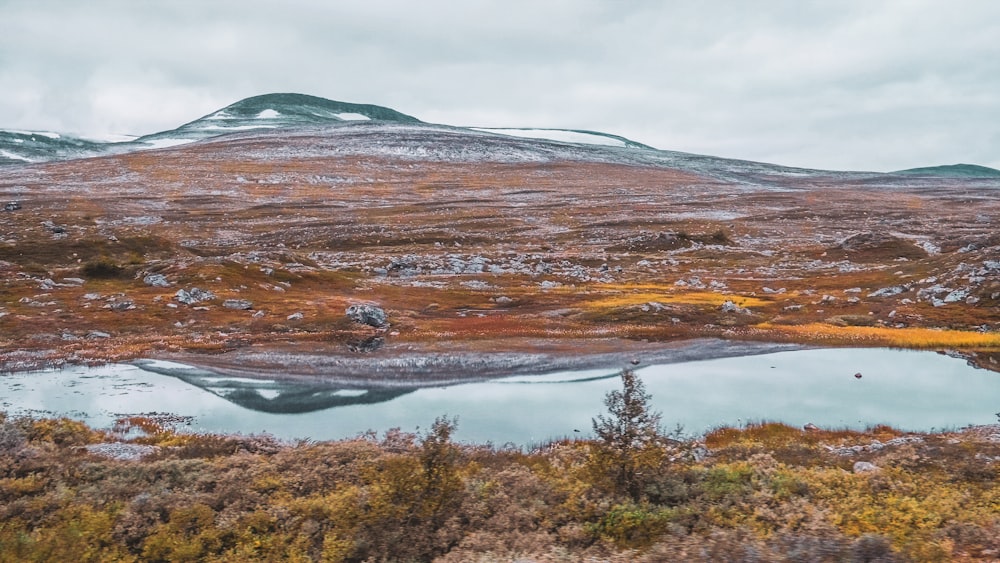 a mountain with a lake in the middle of it