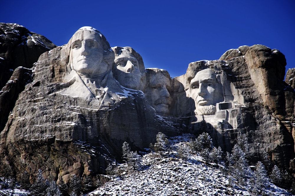 a group of presidents carved into the side of a mountain