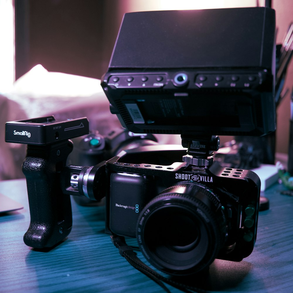 a camera sitting on top of a wooden table