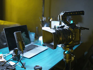 a laptop computer sitting on top of a wooden desk