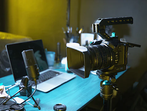 a laptop computer sitting on top of a wooden desk