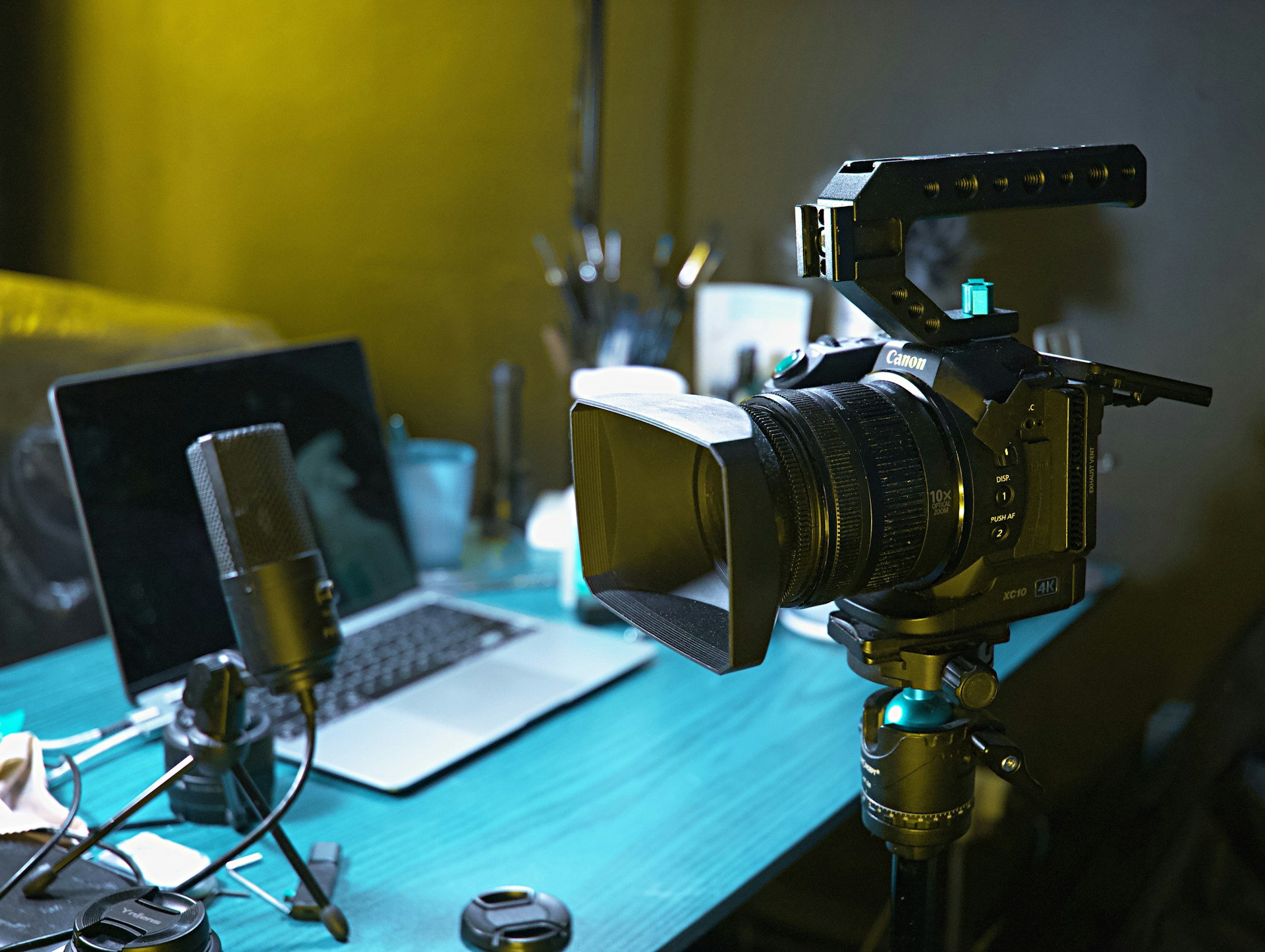 a laptop computer sitting on top of a wooden desk