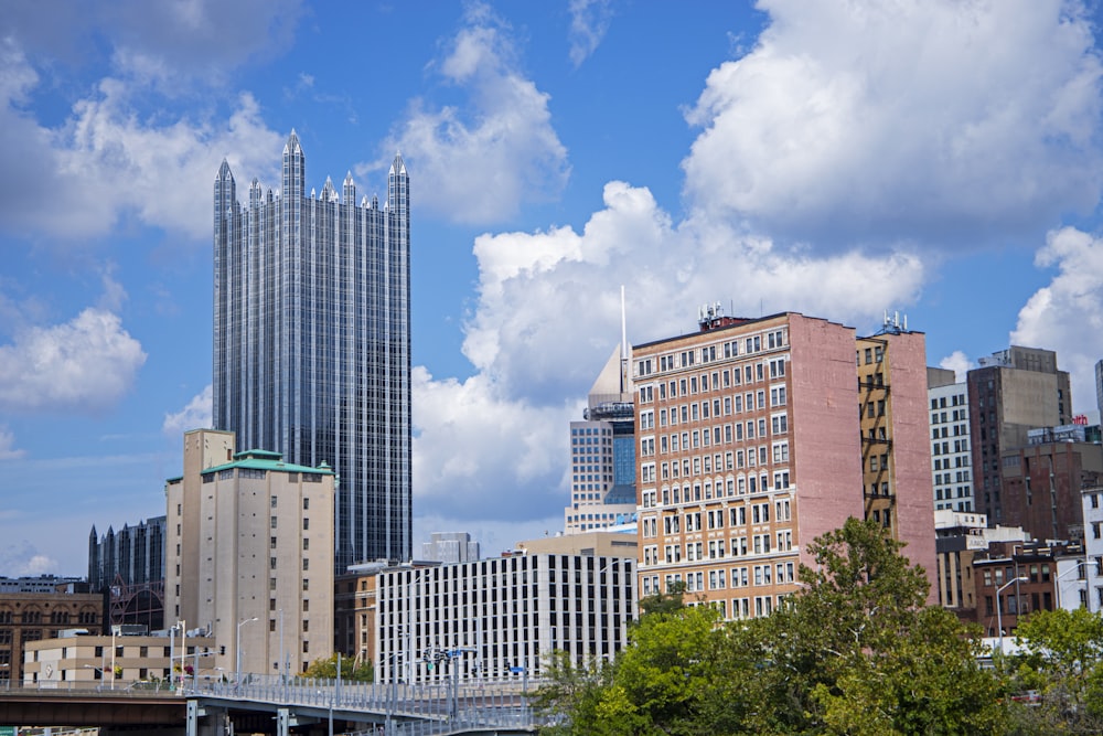 a view of a city with tall buildings and a bridge