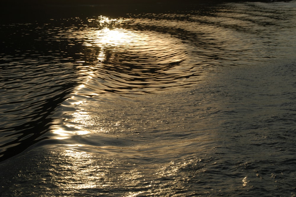 the sun shines on the water as it reflects in the water