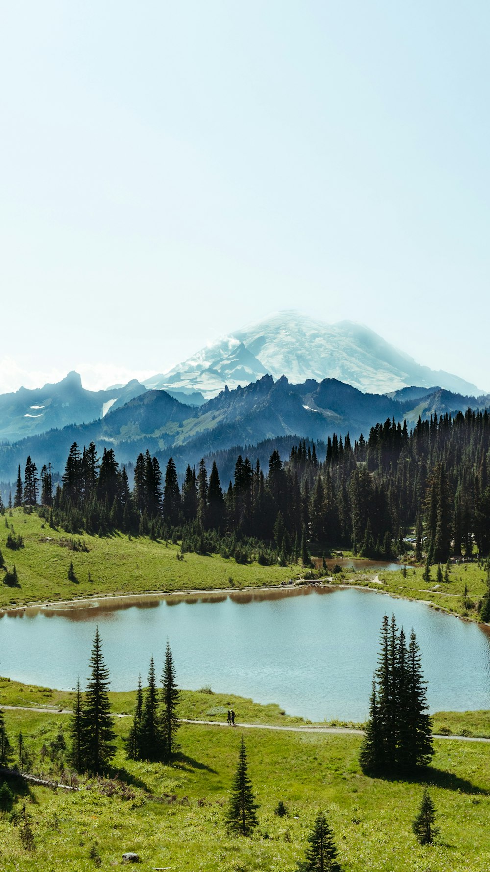 a mountain range with a lake in the foreground