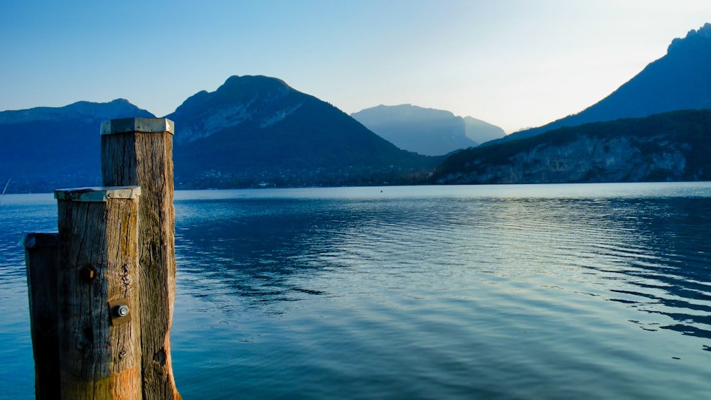 a body of water with mountains in the background