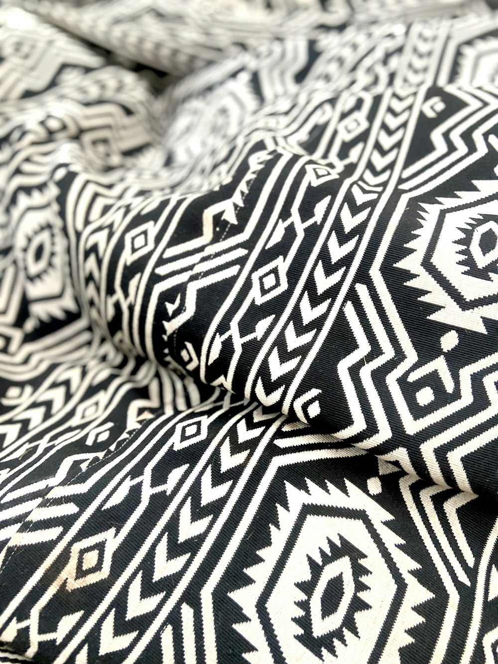 a close up of a black and white blanket