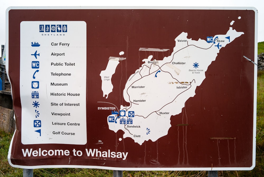 a welcome sign with a map of the area