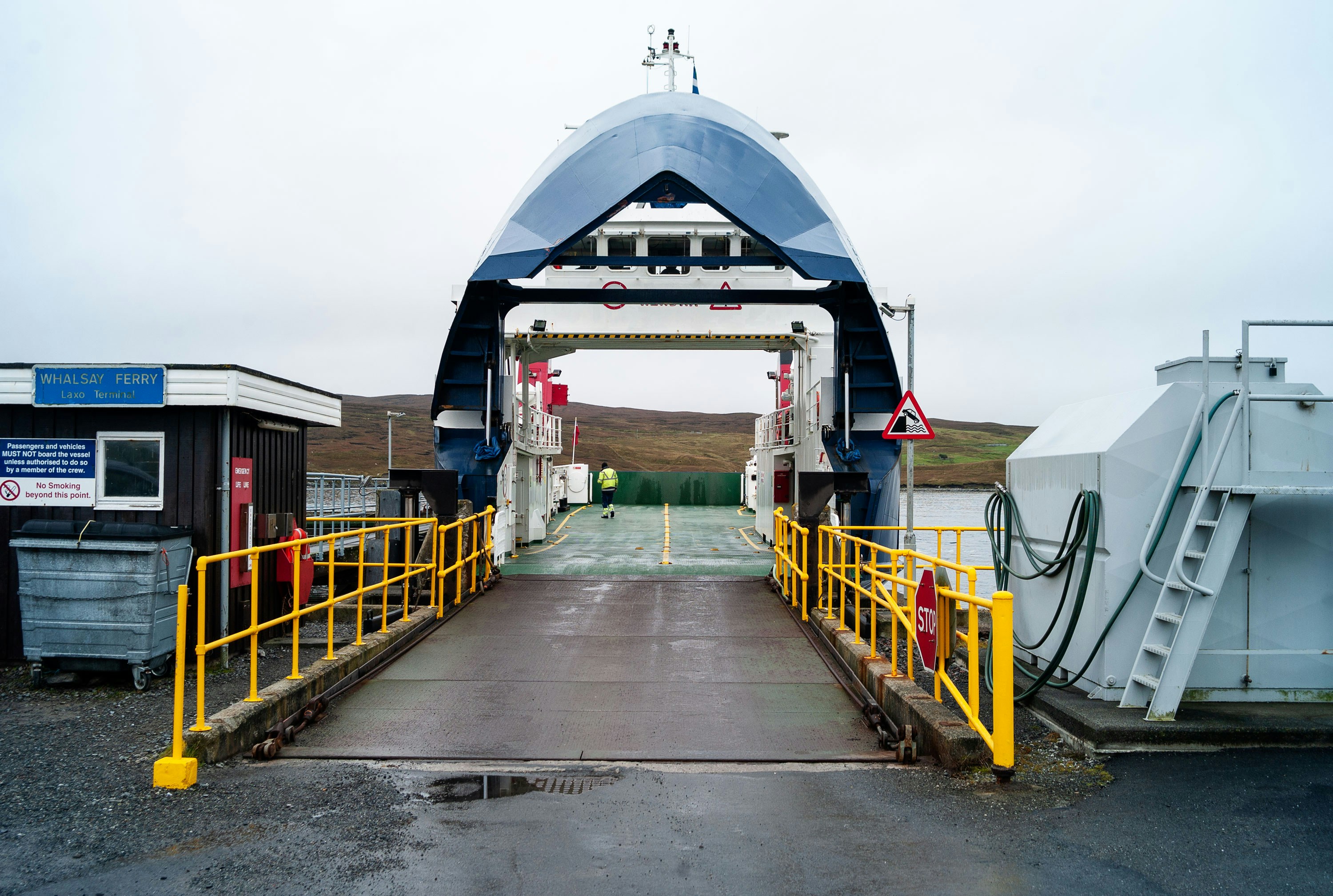 a boat dock with a blue and white boat